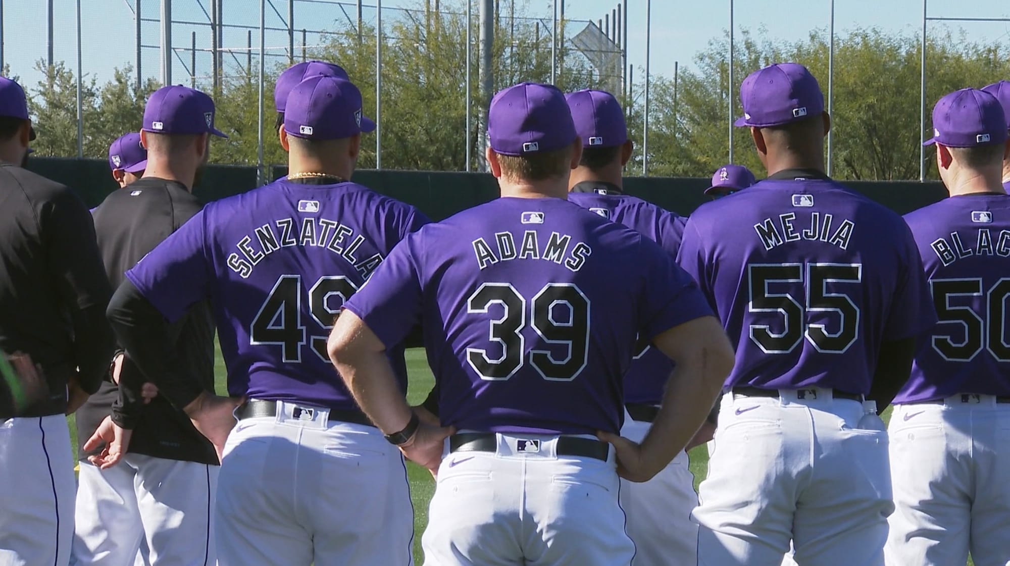 This shows the back of several Rockies players — Senzatela, Adams, Mejia. The players’ names are smaller, and not everything appears centered.
