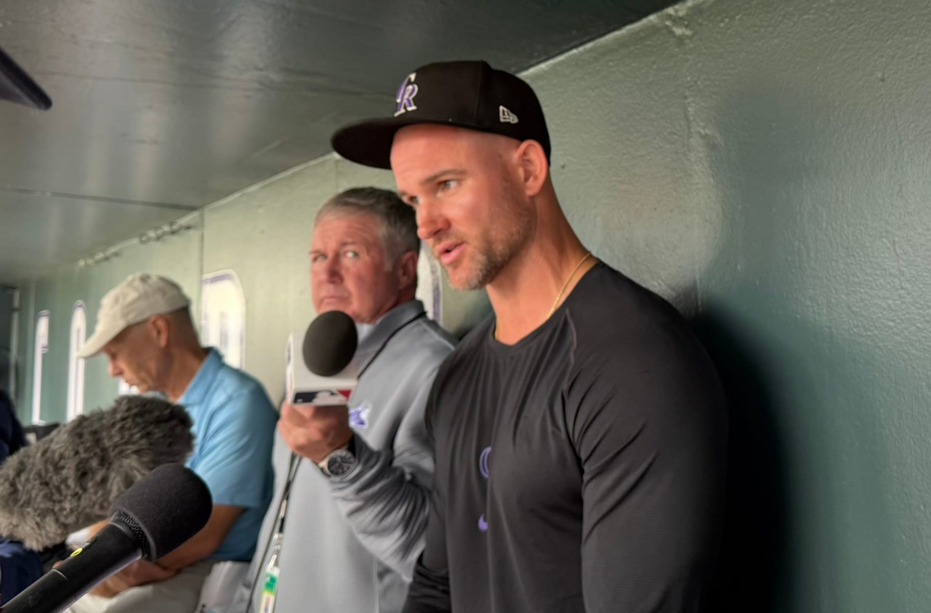 Warren Schaeffer answers questions in the Rockies dugout.