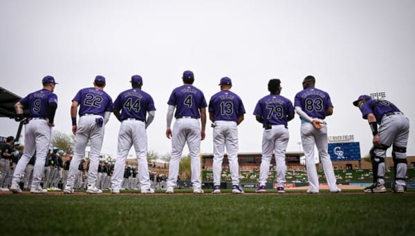 Doyle, Jones, Montero, Toglia, Trejo, Amador, and Carreras photographed from behind at Salt River Fields. They’re wearing